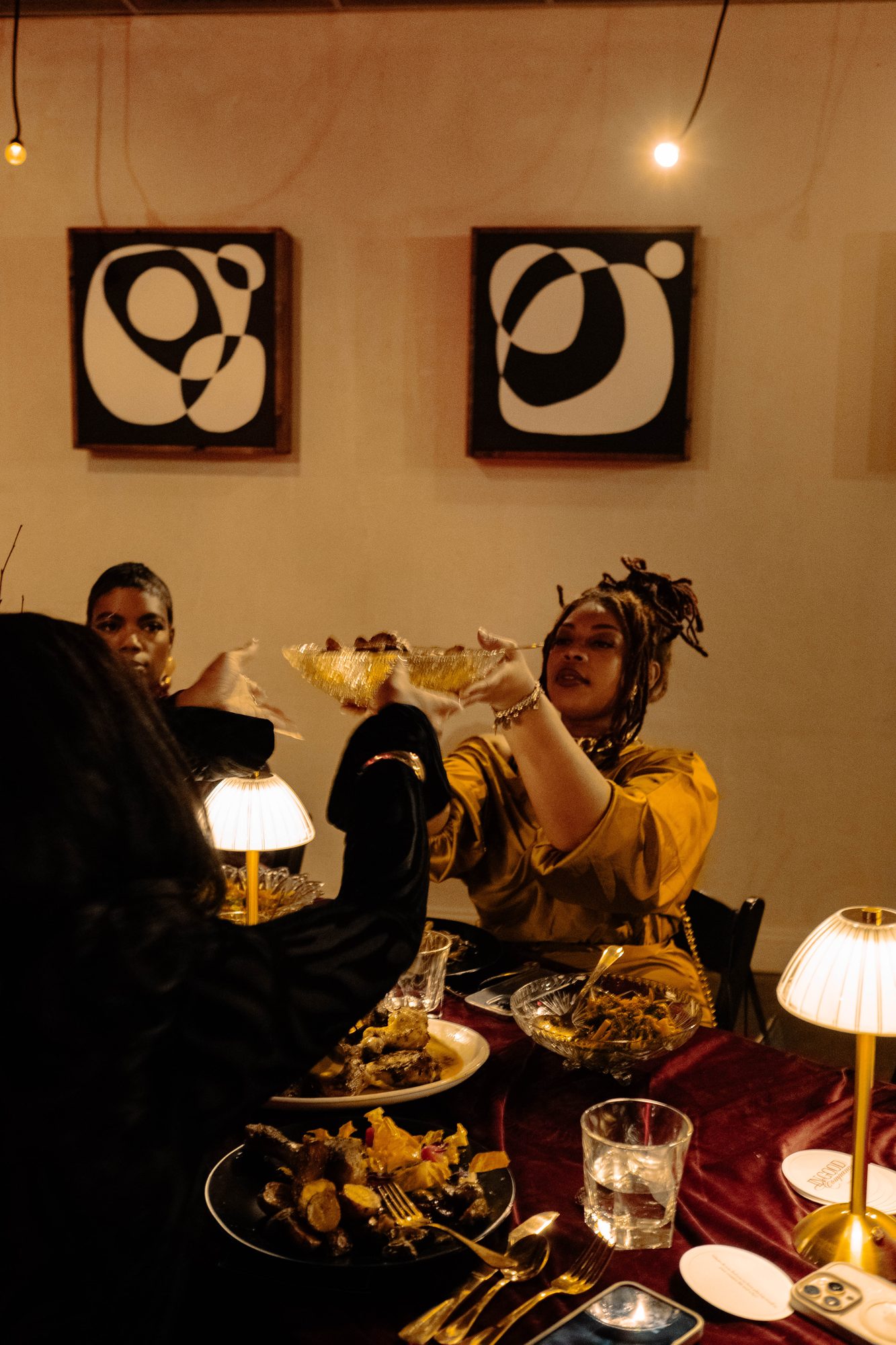 Guests passing dishes at the dinner